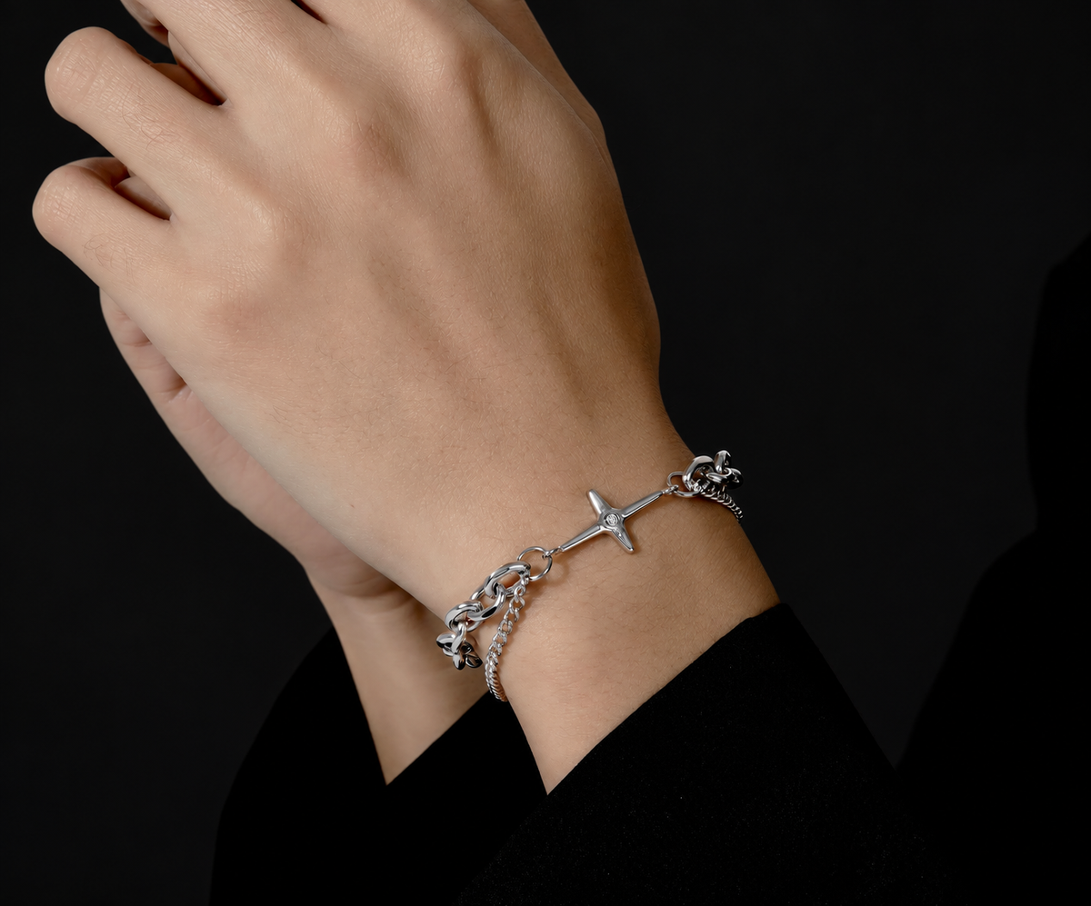 Hades men's sterling silver layered bracelet with star charm worn on the wrist