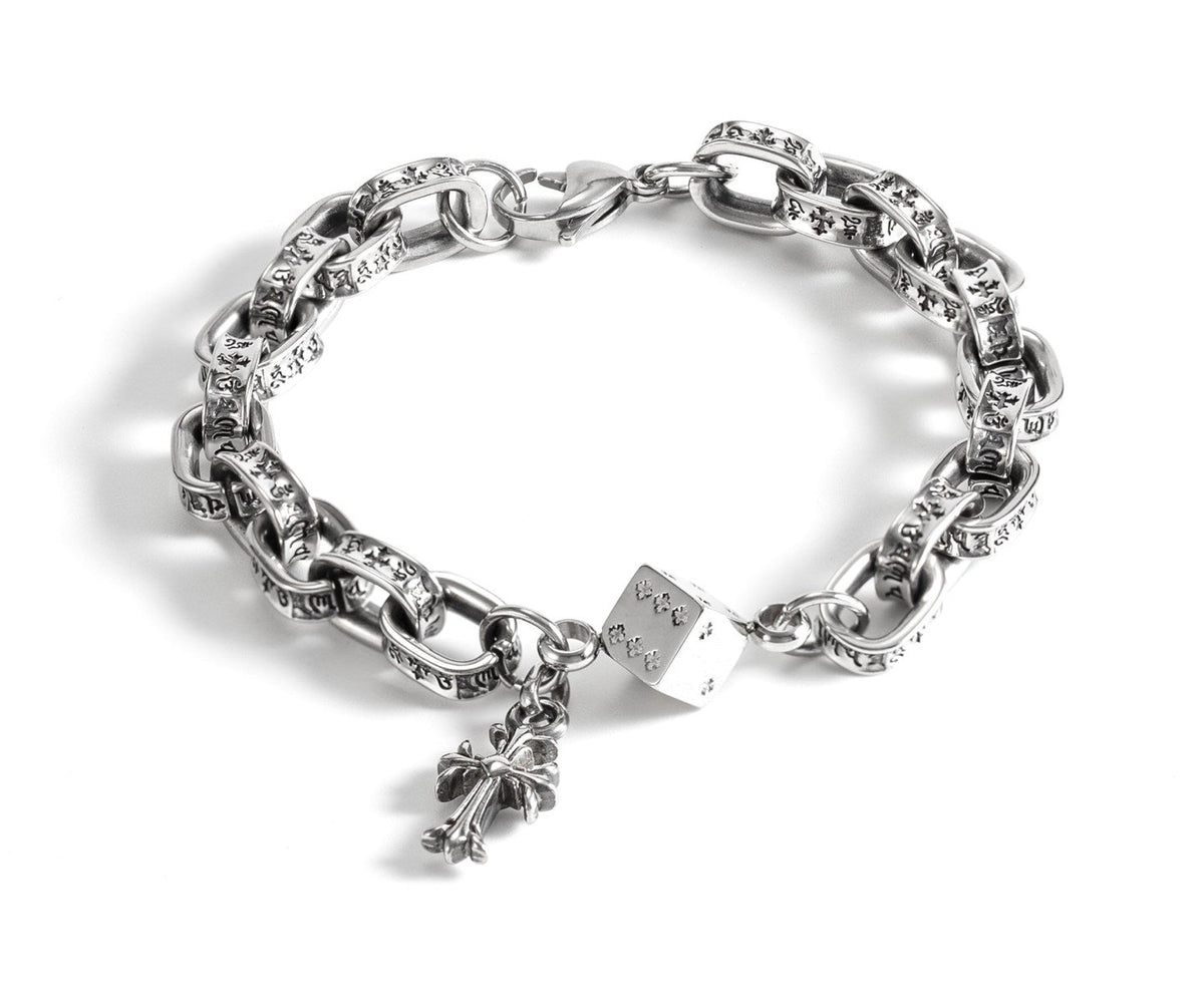Tyche engraved link bracelet with dice and cross charms