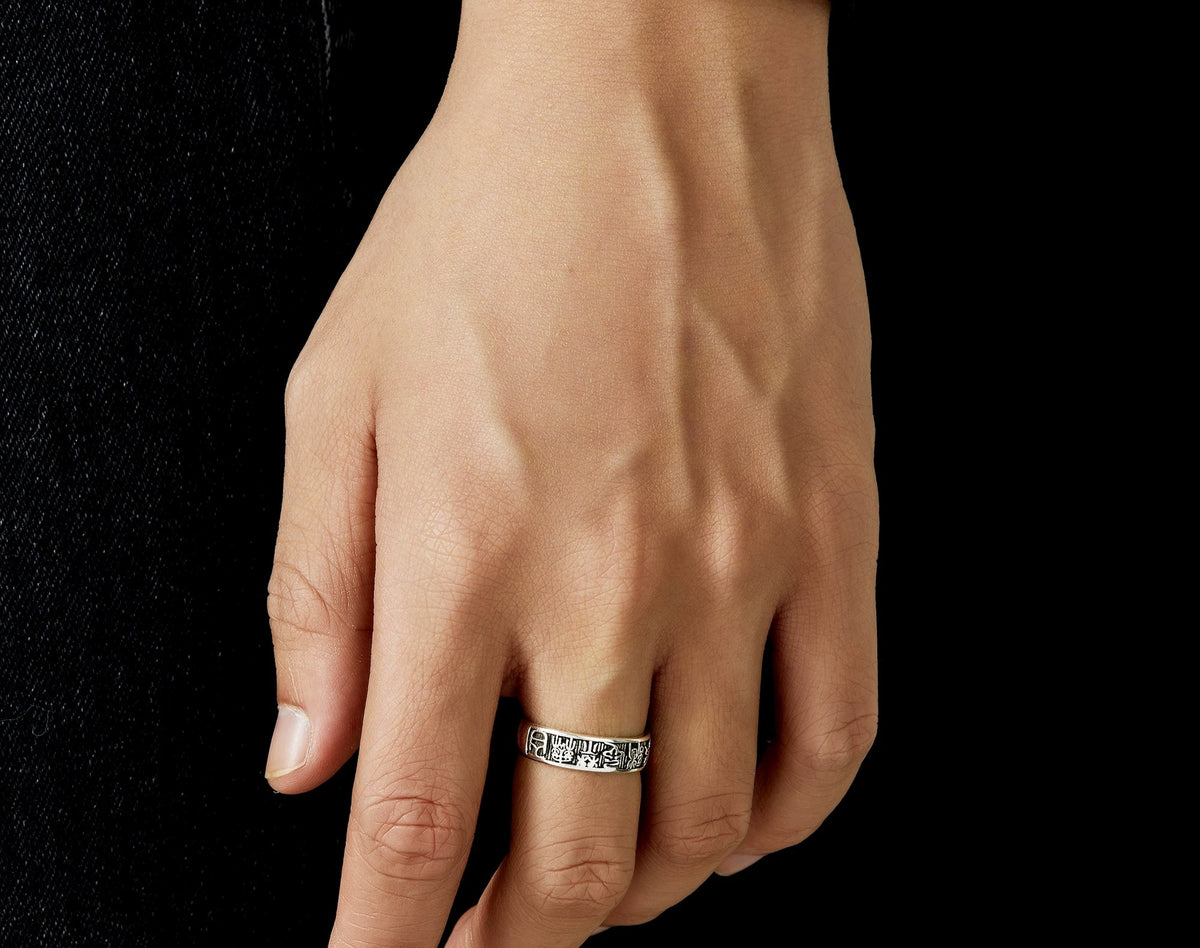Fortuna open silver band with engraved talisman-like pattern