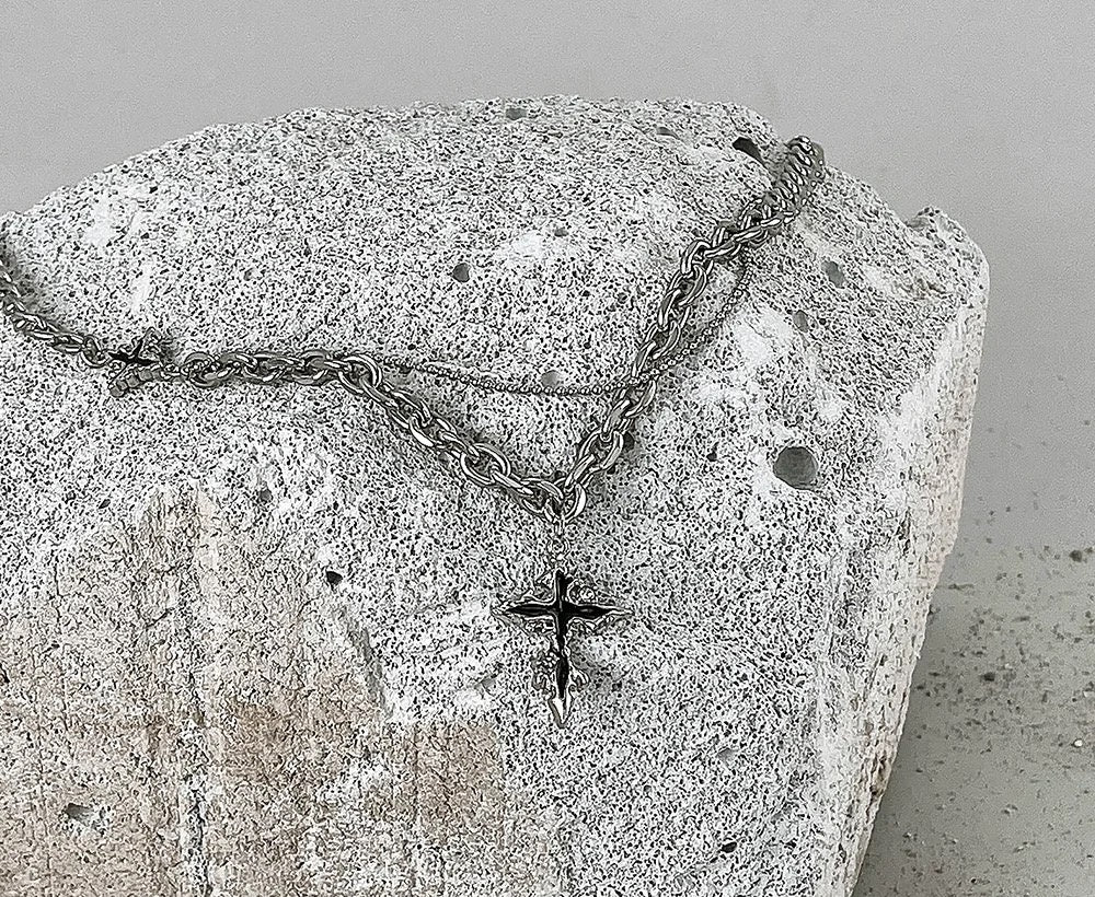 Hypnos silver melting-cross pendant with star charm
