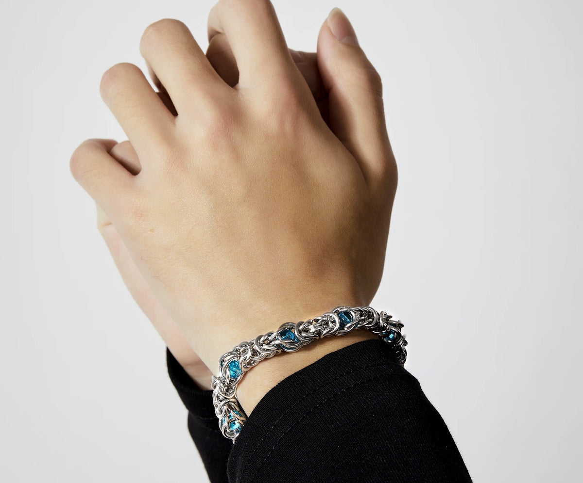 Styx polished silver bracelet with blue sapphire bead accents