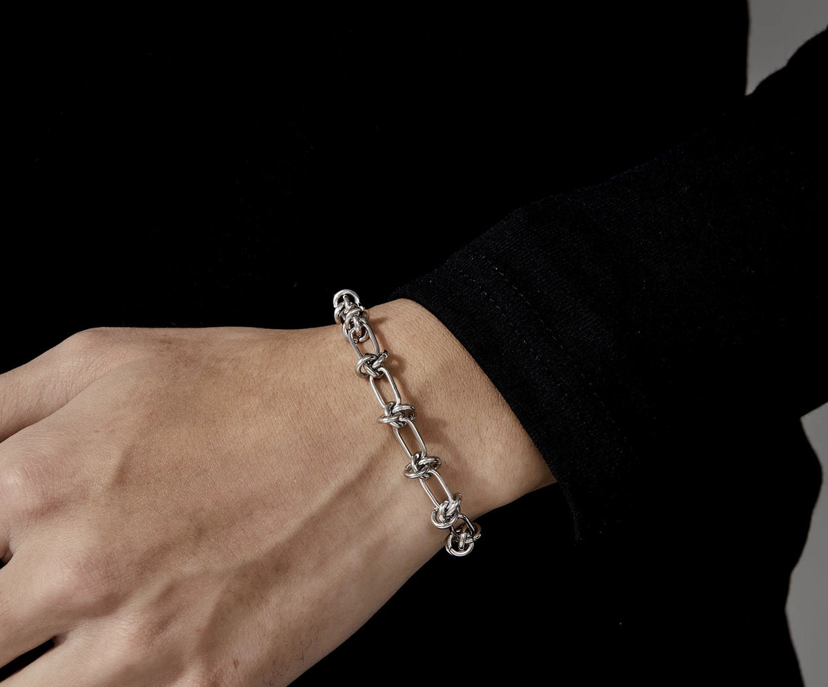 Nemesis 925 silver bracelet with knotted thorn-like links