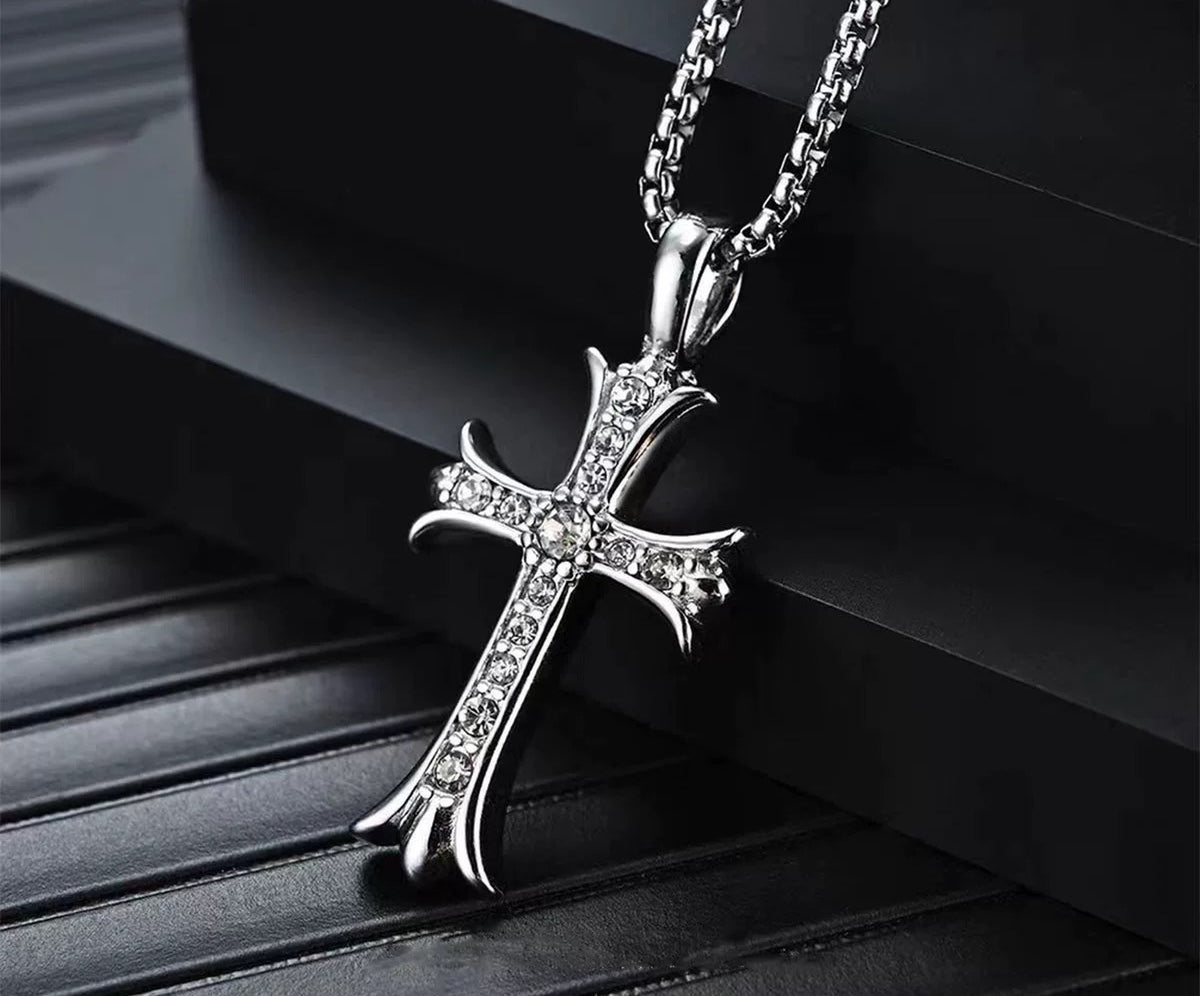 Aether cross pendant necklace with clear stones on a box chain