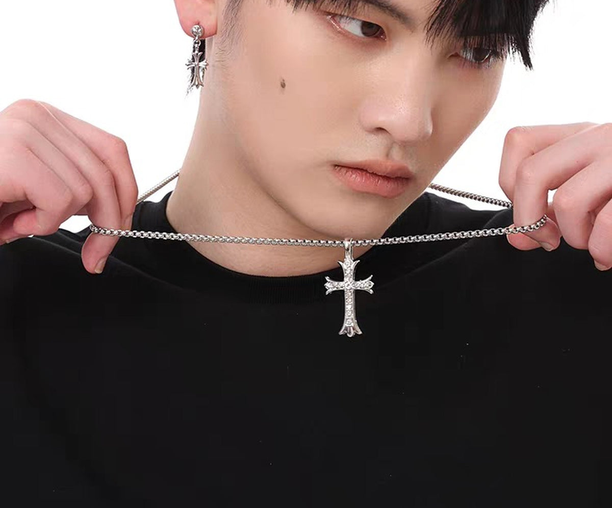 Aether cross pendant necklace held on a box chain