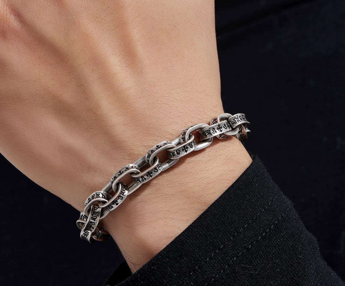 Pluto oxidized sterling silver chain bracelet worn on the wrist