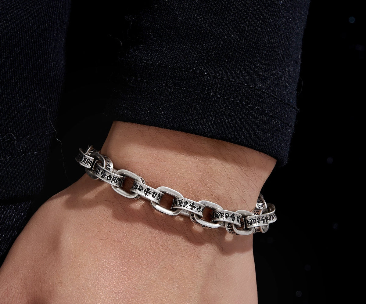 Pluto antiqued 925 silver bracelet with cross, crown and Roman numeral motifs