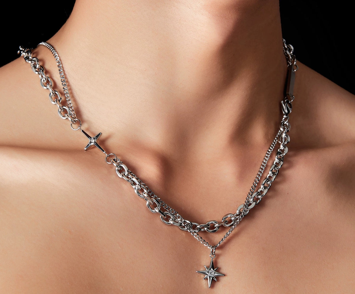 Nyx cubic-zirconia star pendant and small cross necklace